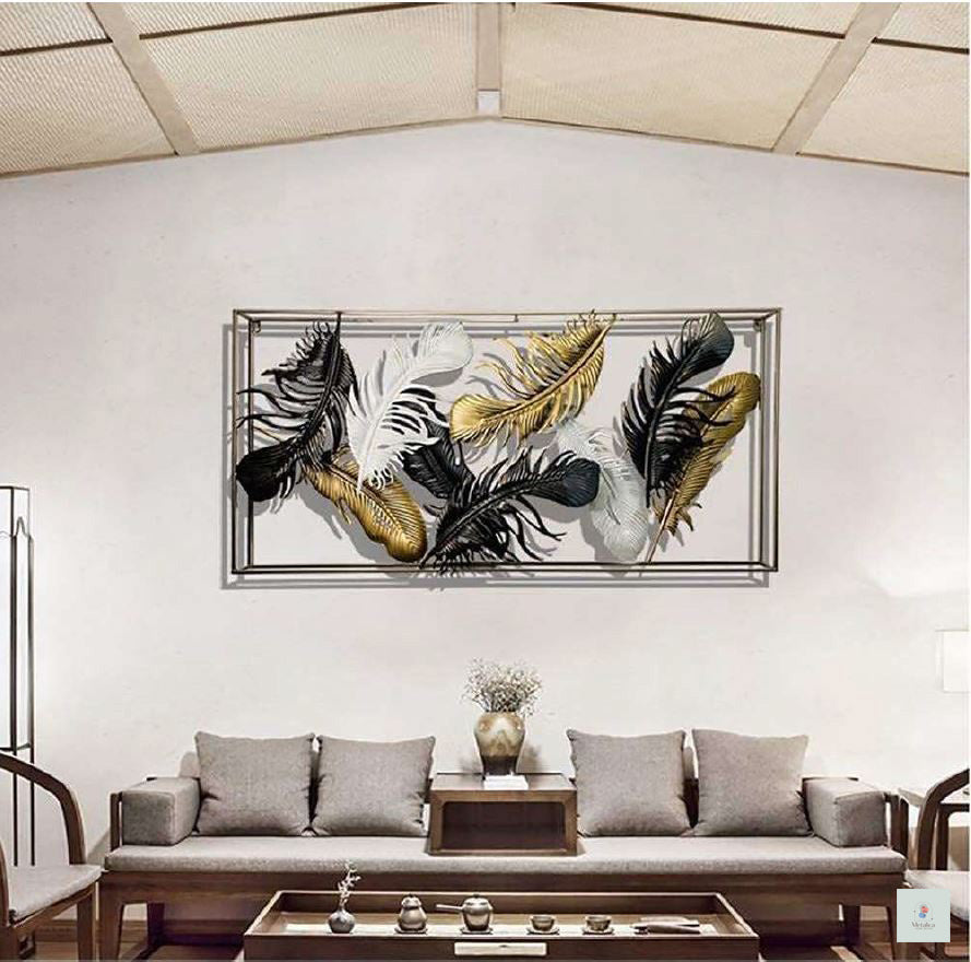 Decorative wall art with feathers in a living room setting