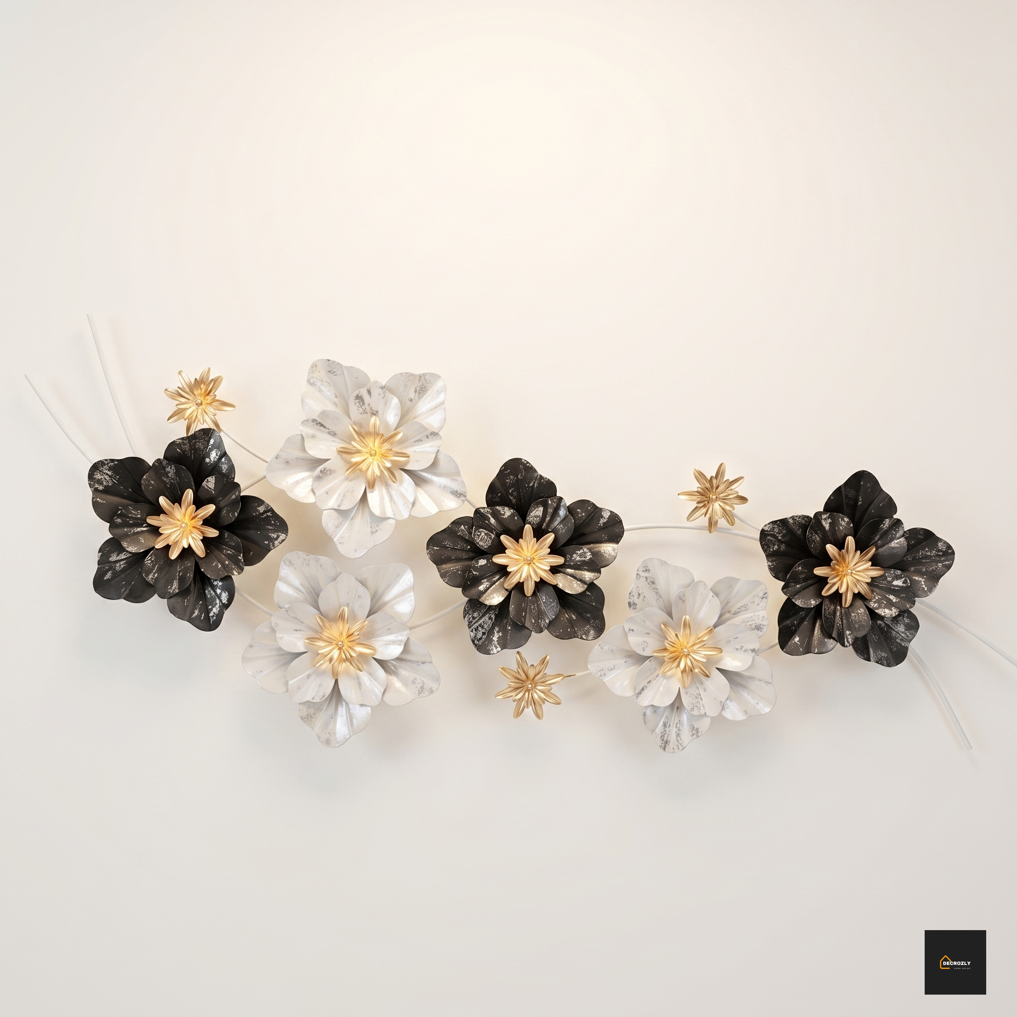 Decorative wall art with black, white, and gold flowers on a light beige background