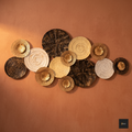 Decorative wall art with round, wicker-like plates in various colors on a warm brown background.