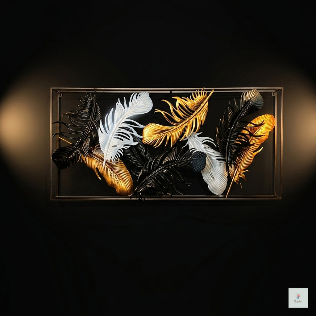 Decorative wall art with feathers in gold, white, and black on a dark background