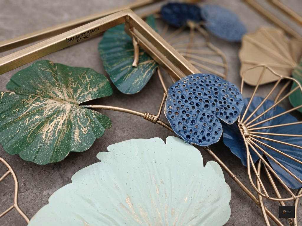 Decorative leaves with gold and blue patterns on a textured surface