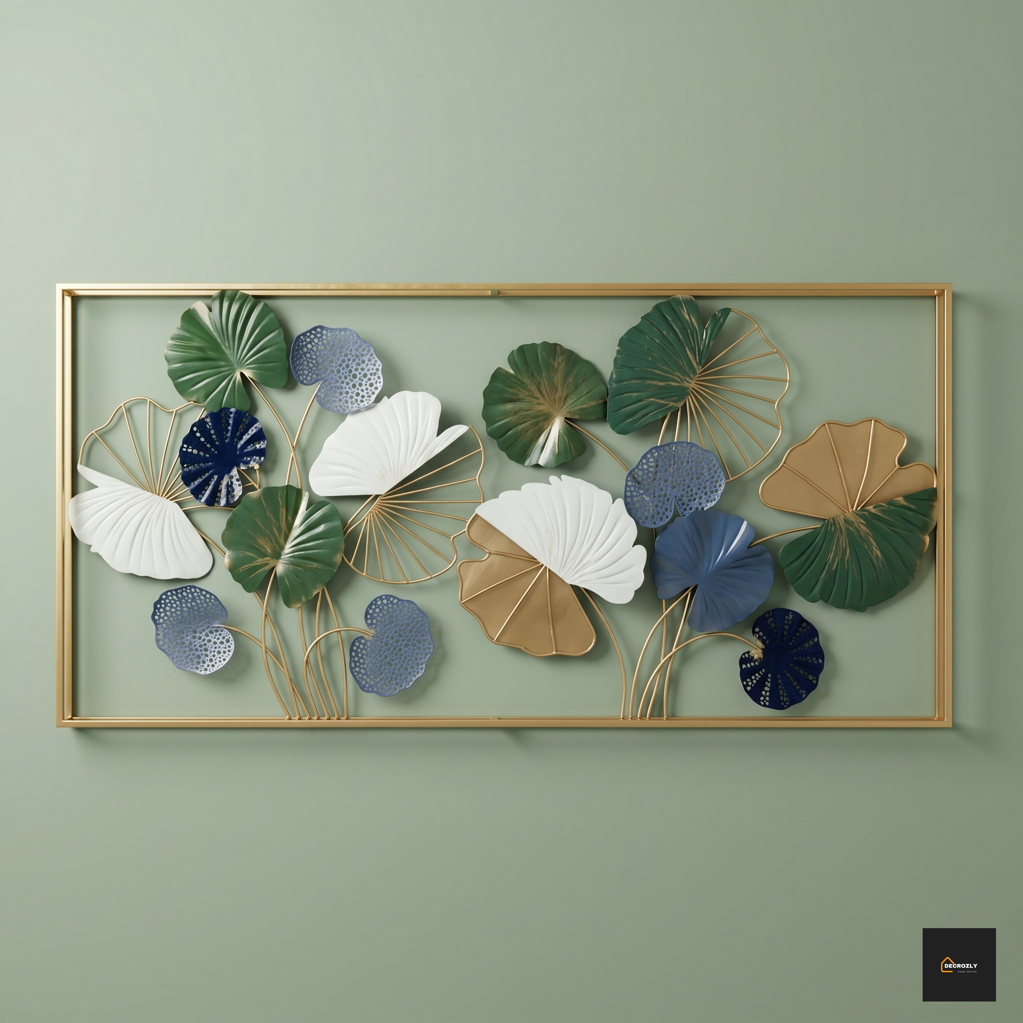 Decorative wall art with leaf patterns in a gold frame on a green wall