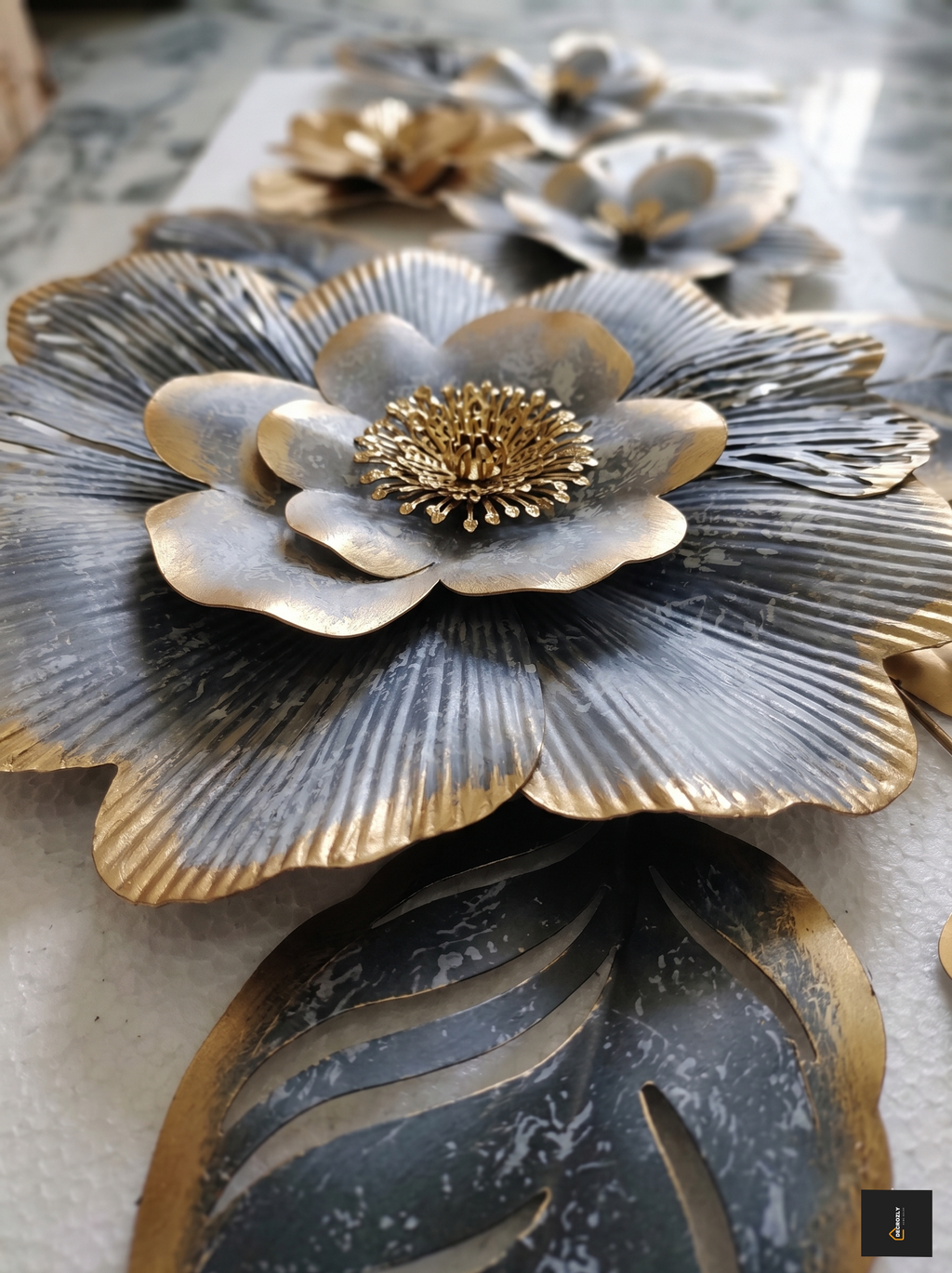 Metallic floral decorations on a textured surface