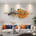 48x24 modern Zen ginkgo leaf wall art, botanical metal sculpture with gold and teal leaves on orange and grey circular background for living room decor.