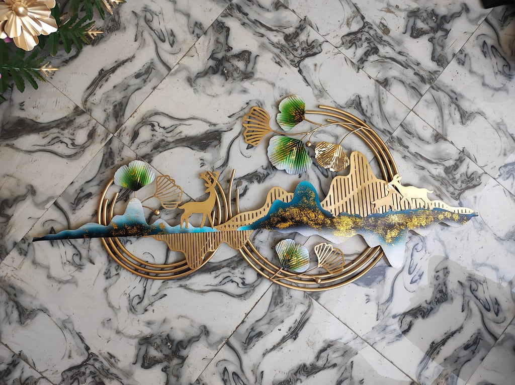 Decorative wall art with gold and blue elements on a marble surface