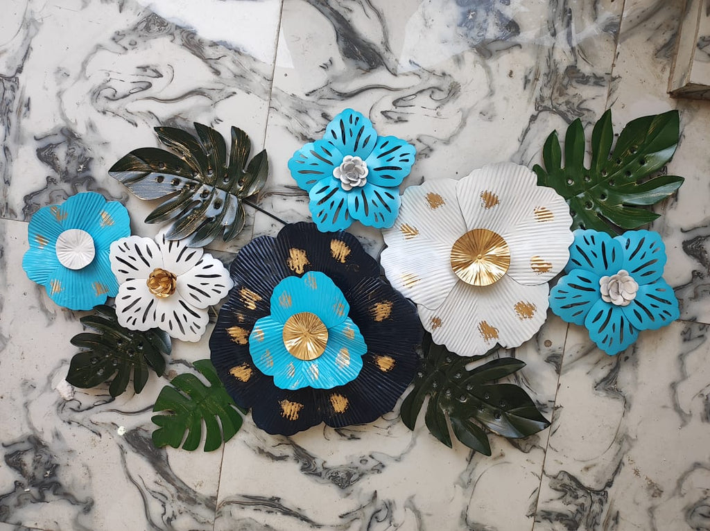 Decorative metal wall art on a marble surface