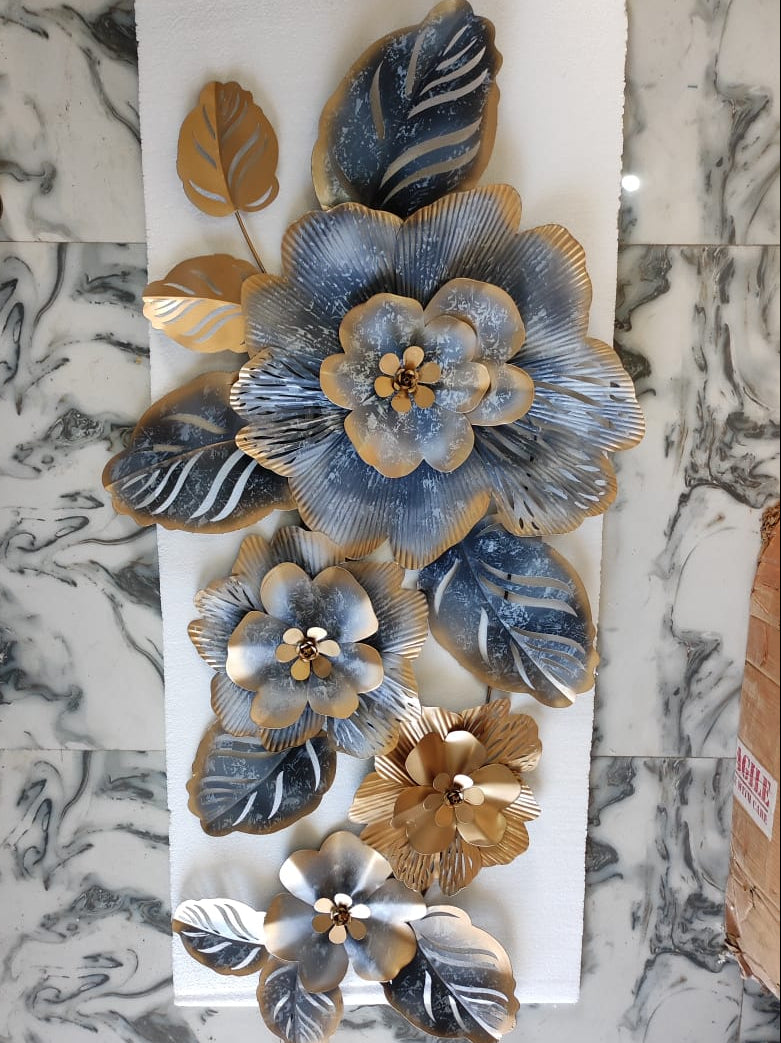 Decorative wall panel with floral designs on a marble surface